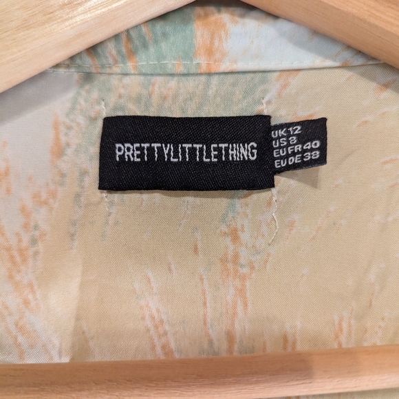 PrettyLittleThing Pastel Orange And Green Patterned Romper - Picture 9 of 10